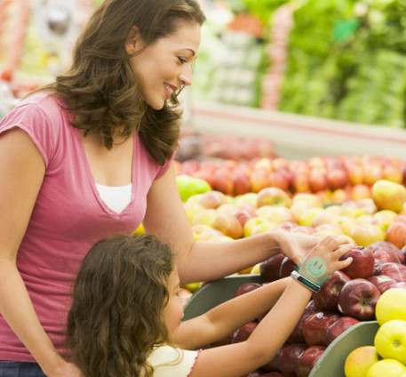Mother and daughter in produce section